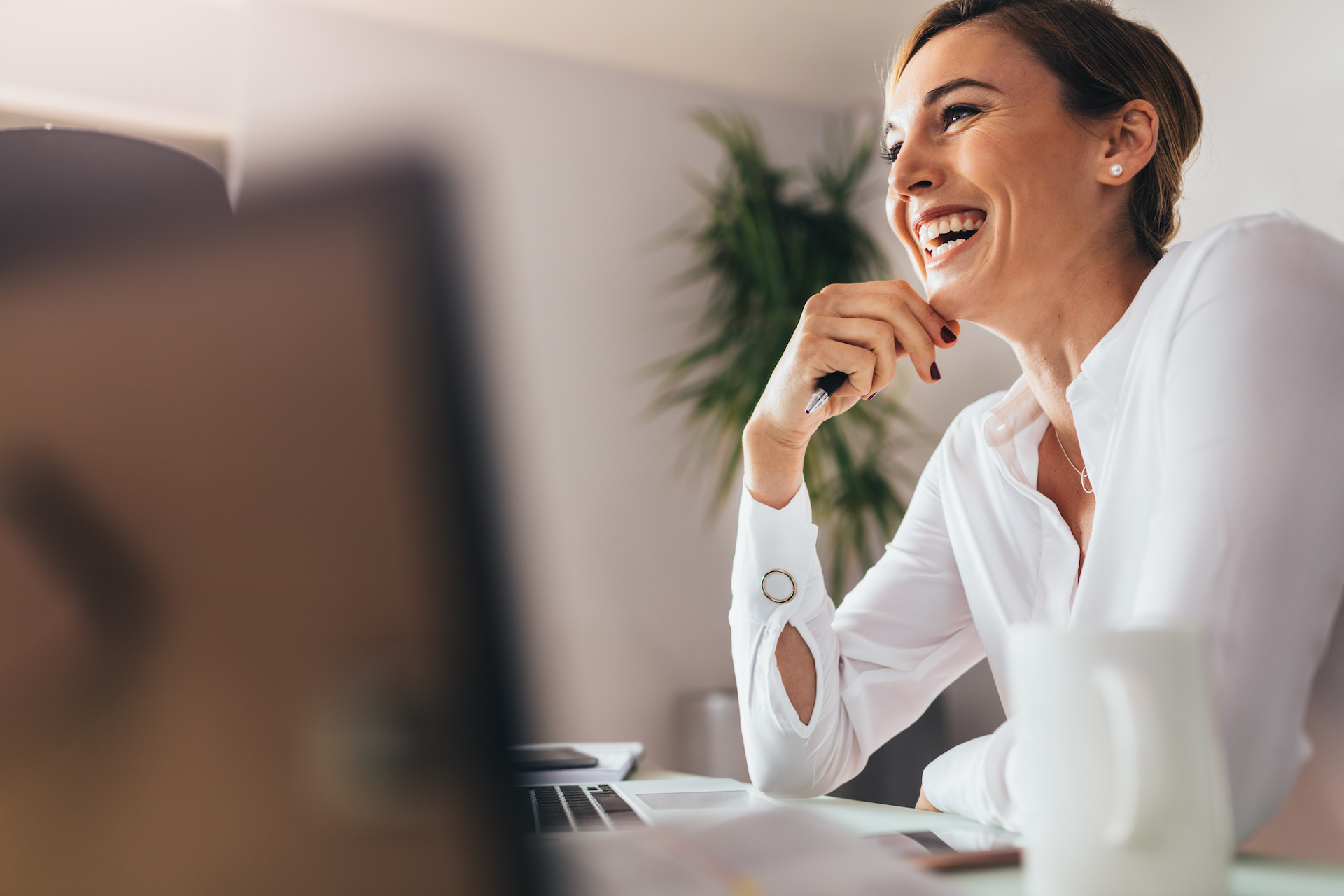 Business Woman Smiling At Desk